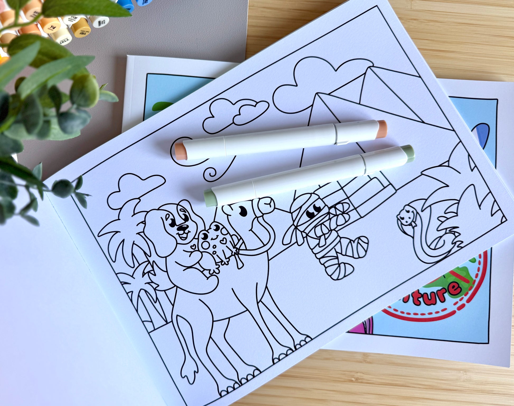 Premium A4 cardstock colouring book for adults and children in the UK featuring hand drawn Doglet and Froglet illustrations with thick bleed-resistant pages for alcohol markers
colouring book about travelling